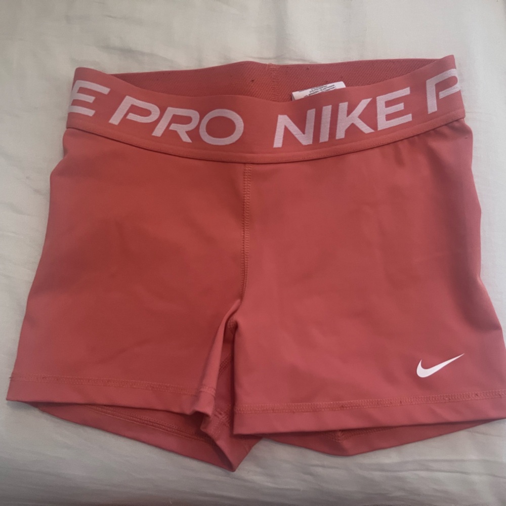 Peach color Nike pros size Small